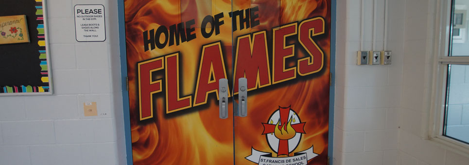 Doors to the gym saying Home of the Flames