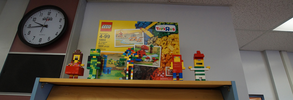 Lego creations on top of a bookcase